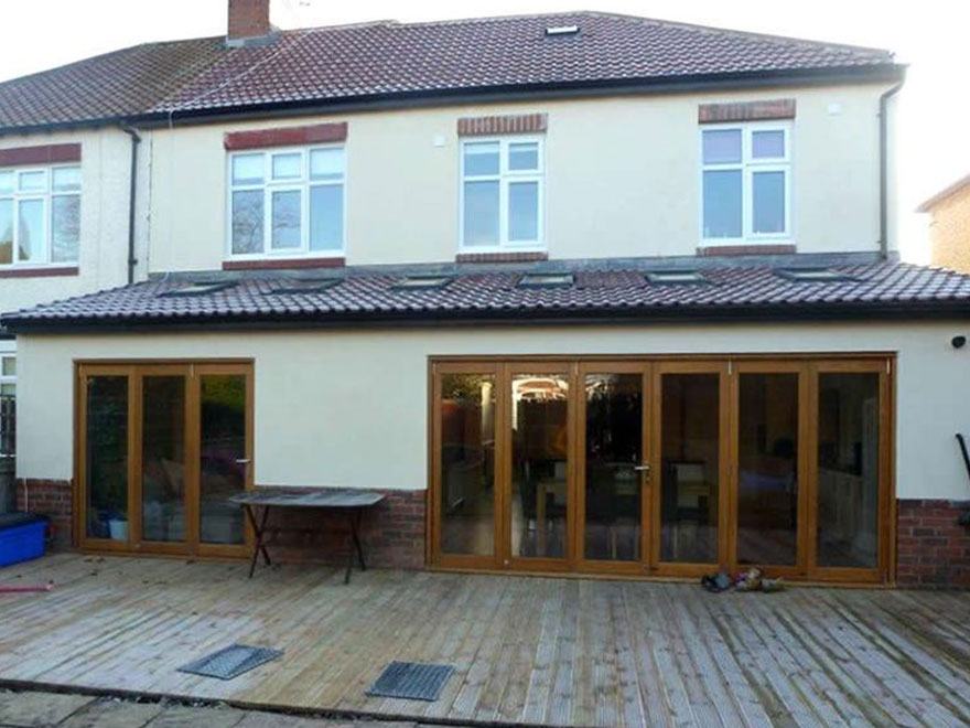 Full-width rear extension with timber bi-folds and decking