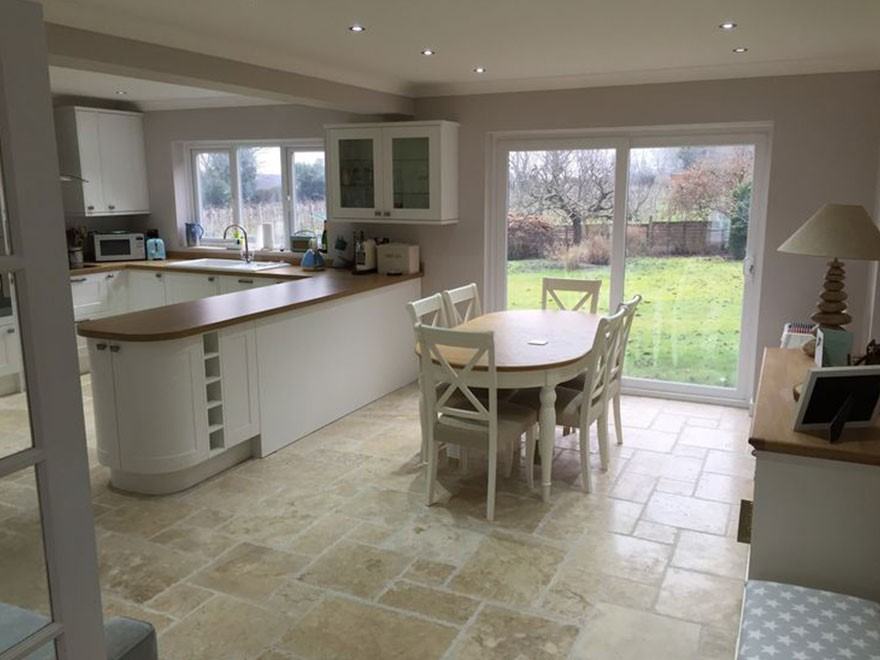 Kitchen extension with island and garden views in Croydon