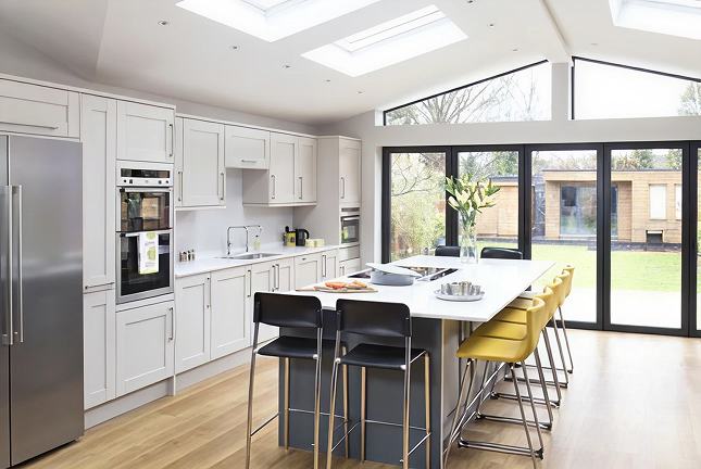 Refurbished kitchen with breakfast bar in a Bromley house