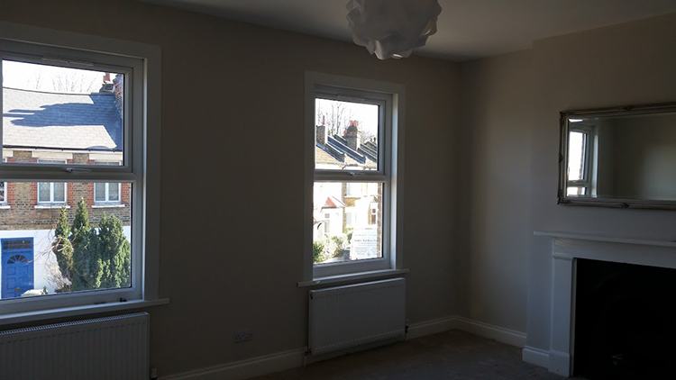 Refurbished bedroom with fireplace