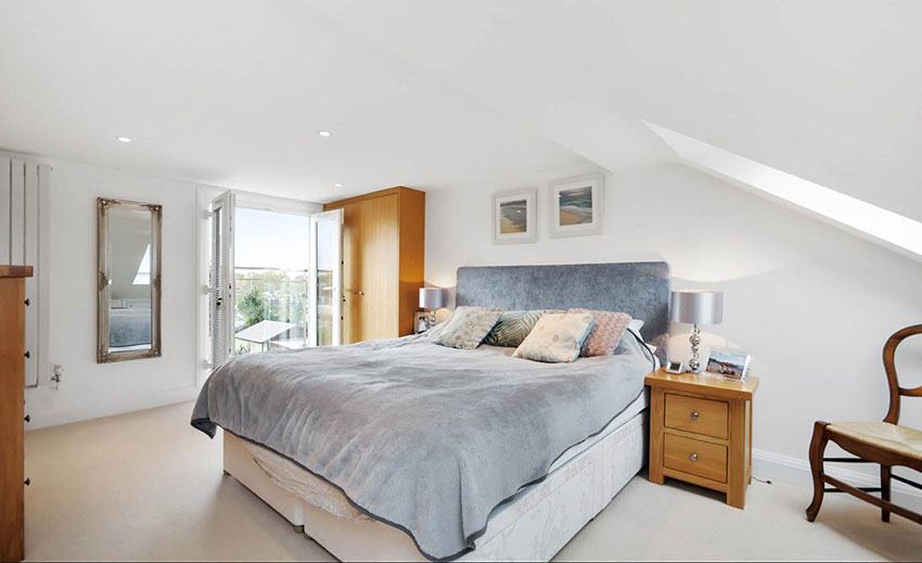 Bright loft conversion bedroom with roof windows