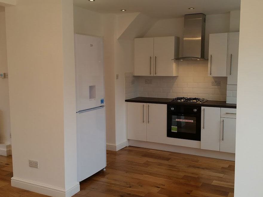 White gloss kitchen at Sandy Bury