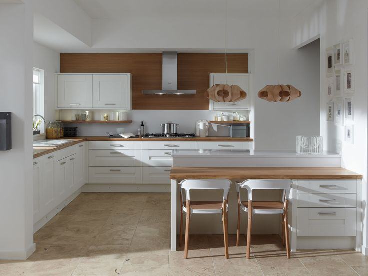 White slab kitchen with oak worktops at The Avenue