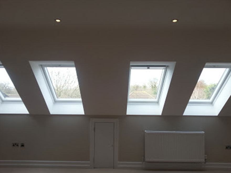 Loft bedroom with three roof windows