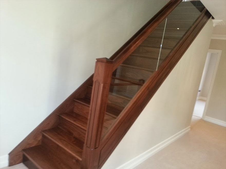 Hardwood staircase with glass balustrade