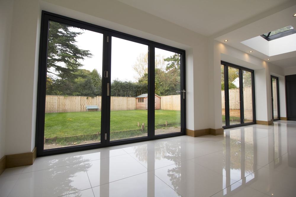 Aluminium bi-fold doors opening onto the garden